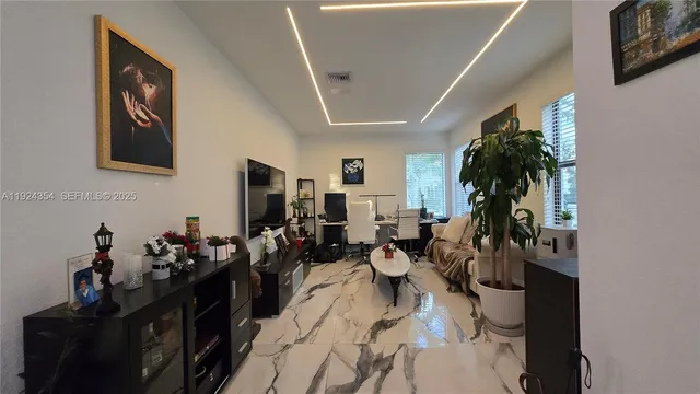 a dining room with furniture and window