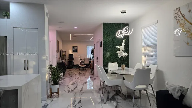 a kitchen with refrigerator and microwave