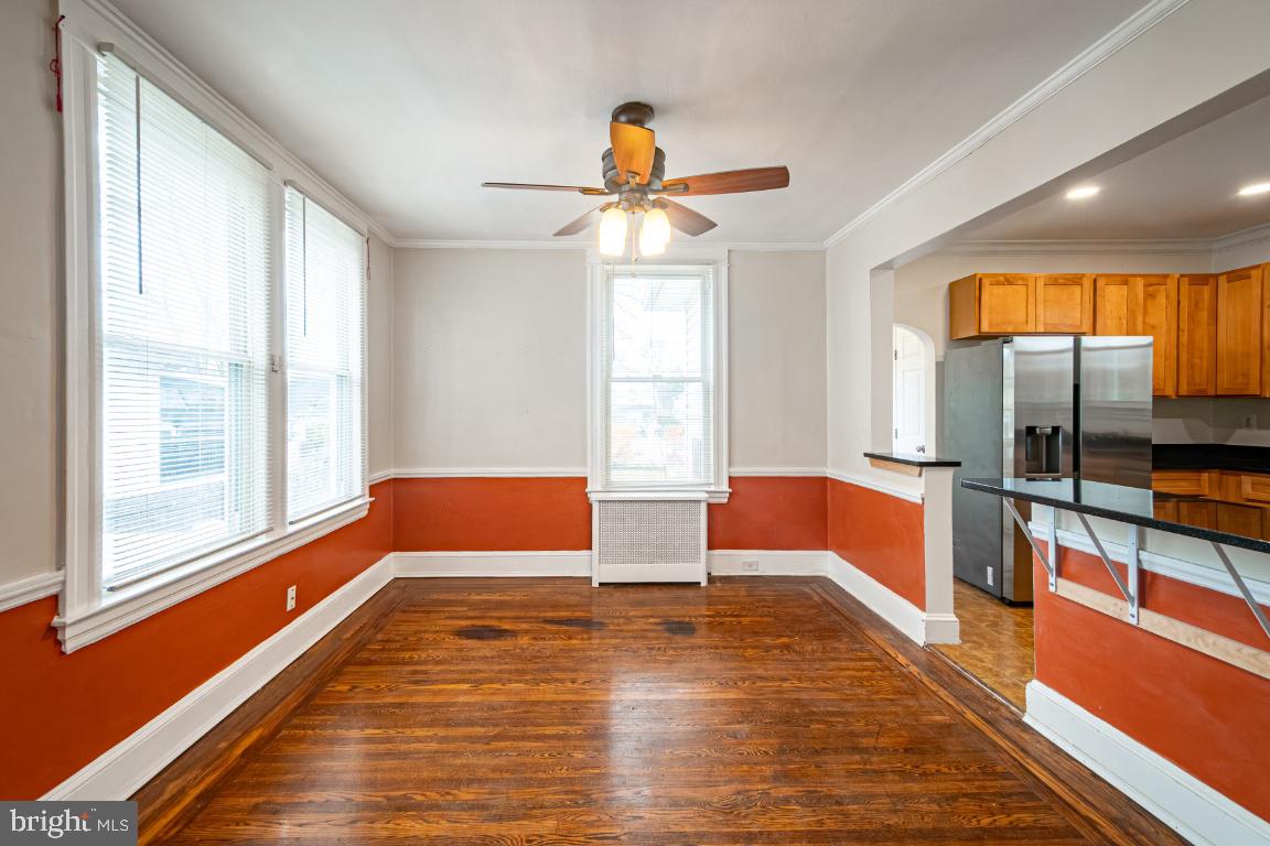 3312 Glen Avenue Baltimore, MD 21215 - Photo 12 of 25 a bedroom with furniture and a large window