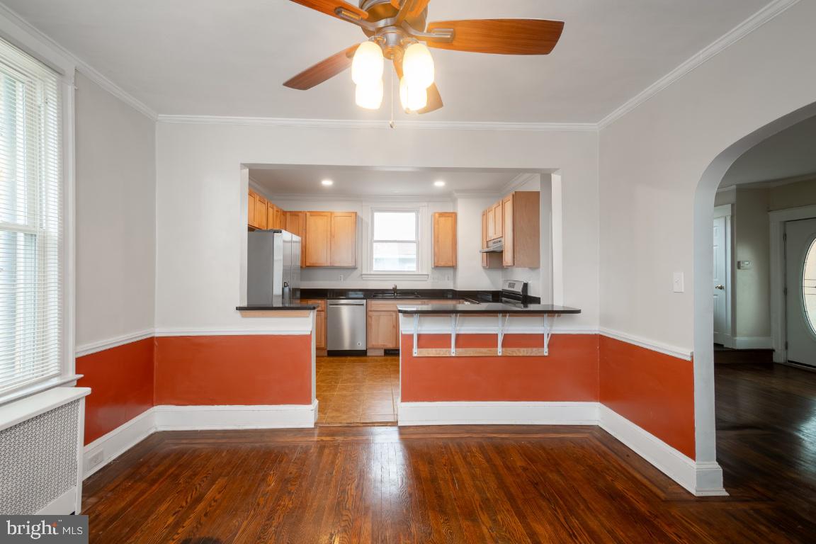 3312 Glen Avenue Baltimore, MD 21215 - Photo 13 of 25 a view of kitchen with sink and wooden floor