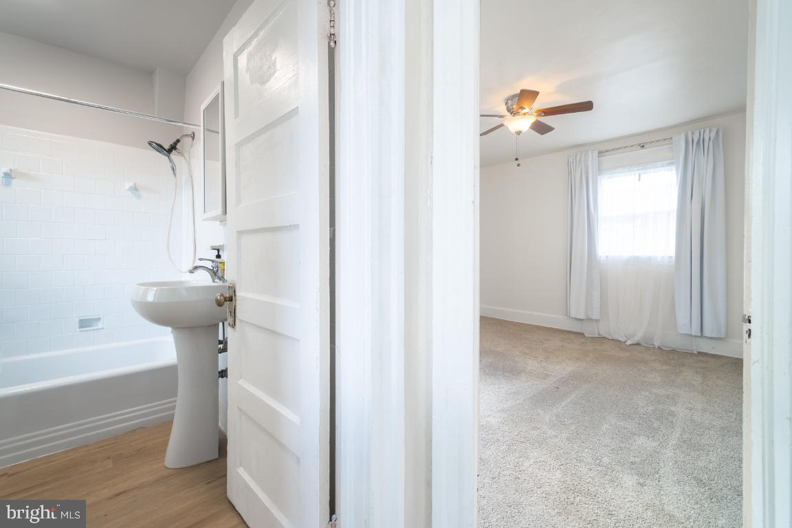 3312 Glen Avenue Baltimore, MD 21215 - Photo 14 of 25 a bathroom with a bathtub and a shower