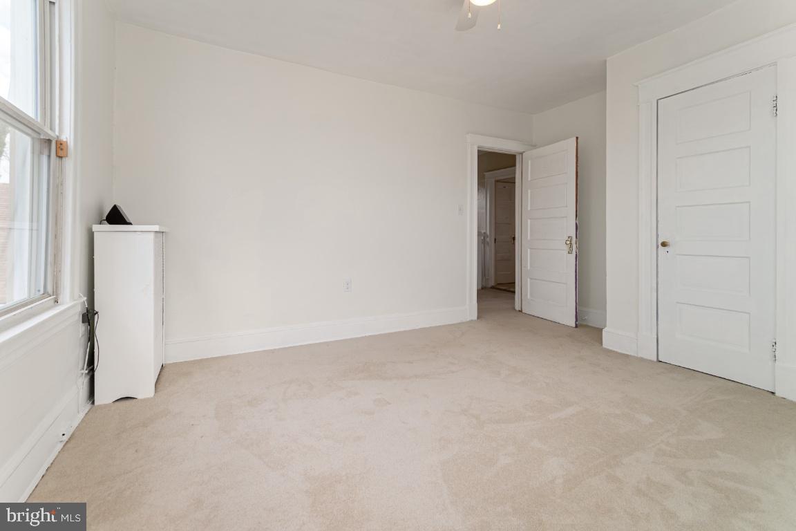 3312 Glen Avenue Baltimore, MD 21215 - Photo 19 of 25 an empty room with windows