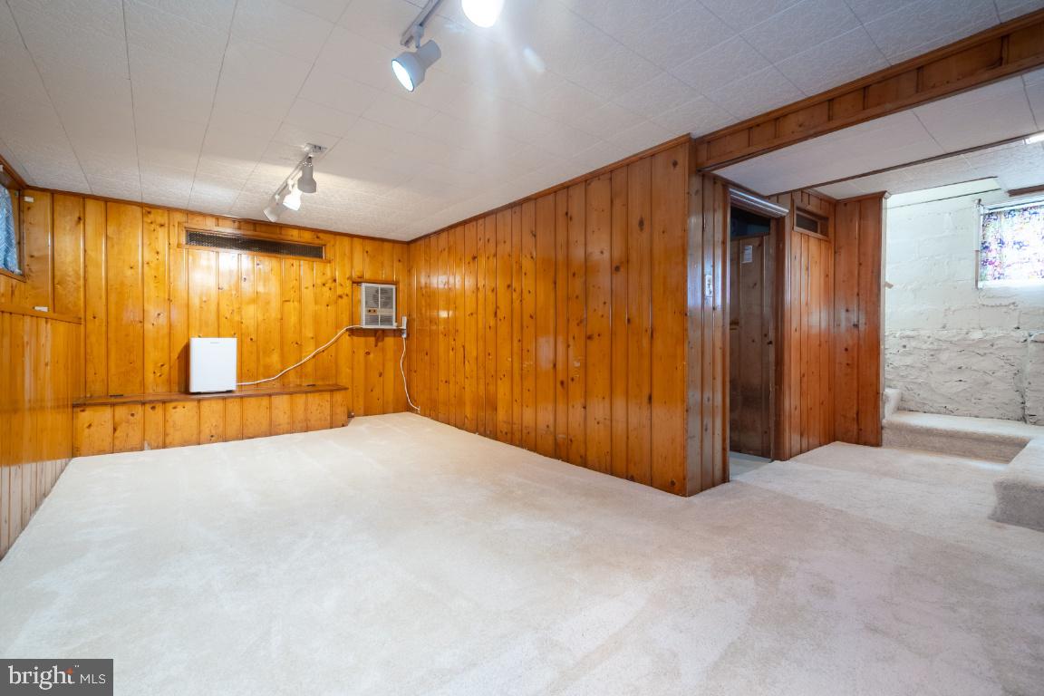 3312 Glen Avenue Baltimore, MD 21215 - Photo 21 of 25 a view of an empty room with wooden walls