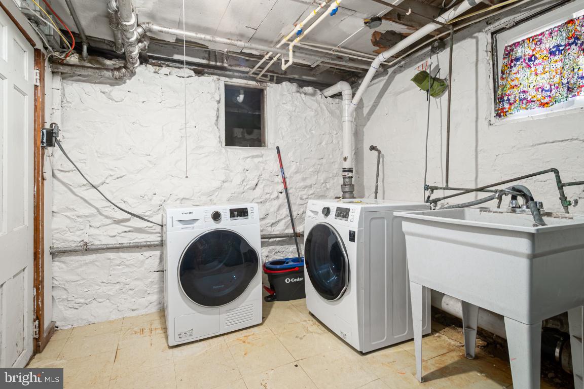 3312 Glen Avenue Baltimore, MD 21215 - Photo 22 of 25 a utility room with dryer and washer