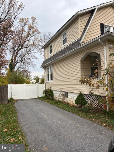 3312 Glen Avenue Baltimore, MD 21215 - Photo 3 of 25 a front view of a house with garage
