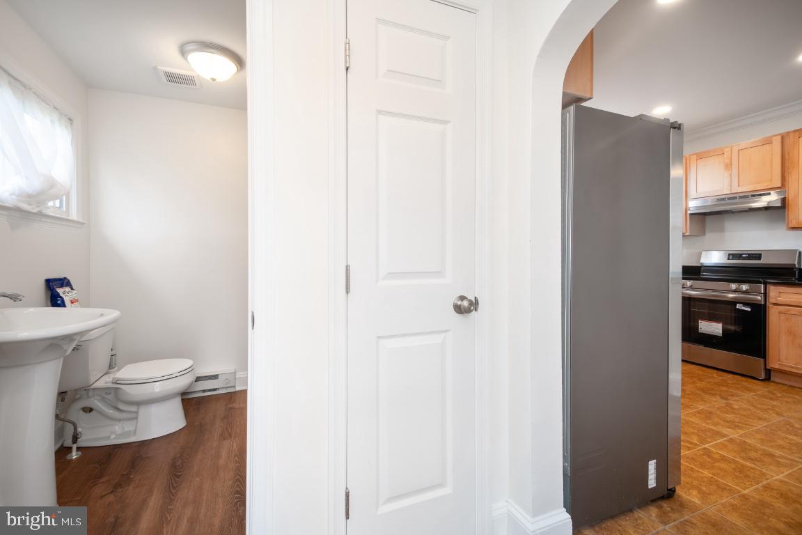 3312 Glen Avenue Baltimore, MD 21215 - Photo 10 of 25 a bathroom with a toilet and a sink