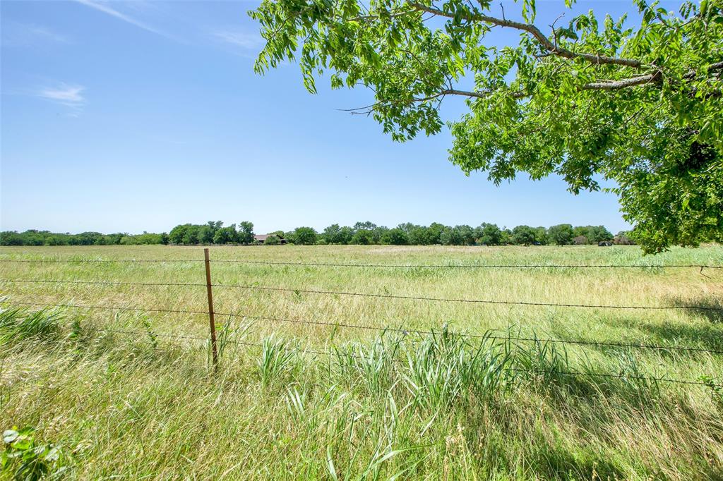 99 Calk Road Tioga, TX 76271 - Photo 16 of 20 a view of a lake with houses in the back