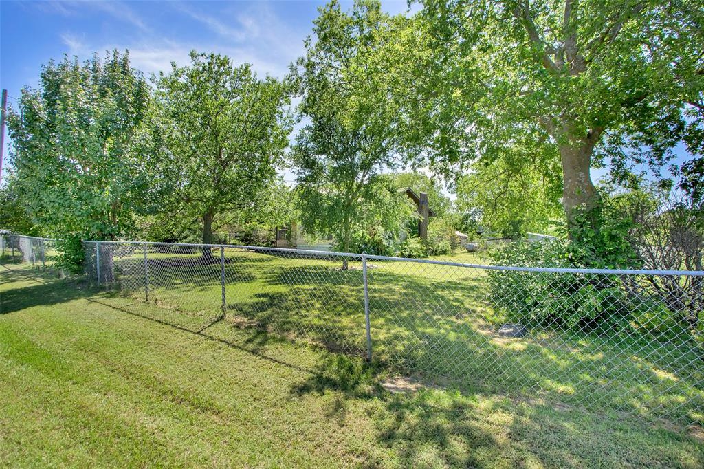 99 Calk Road Tioga, TX 76271 - Photo 10 of 20 a view of a field with trees in the background
