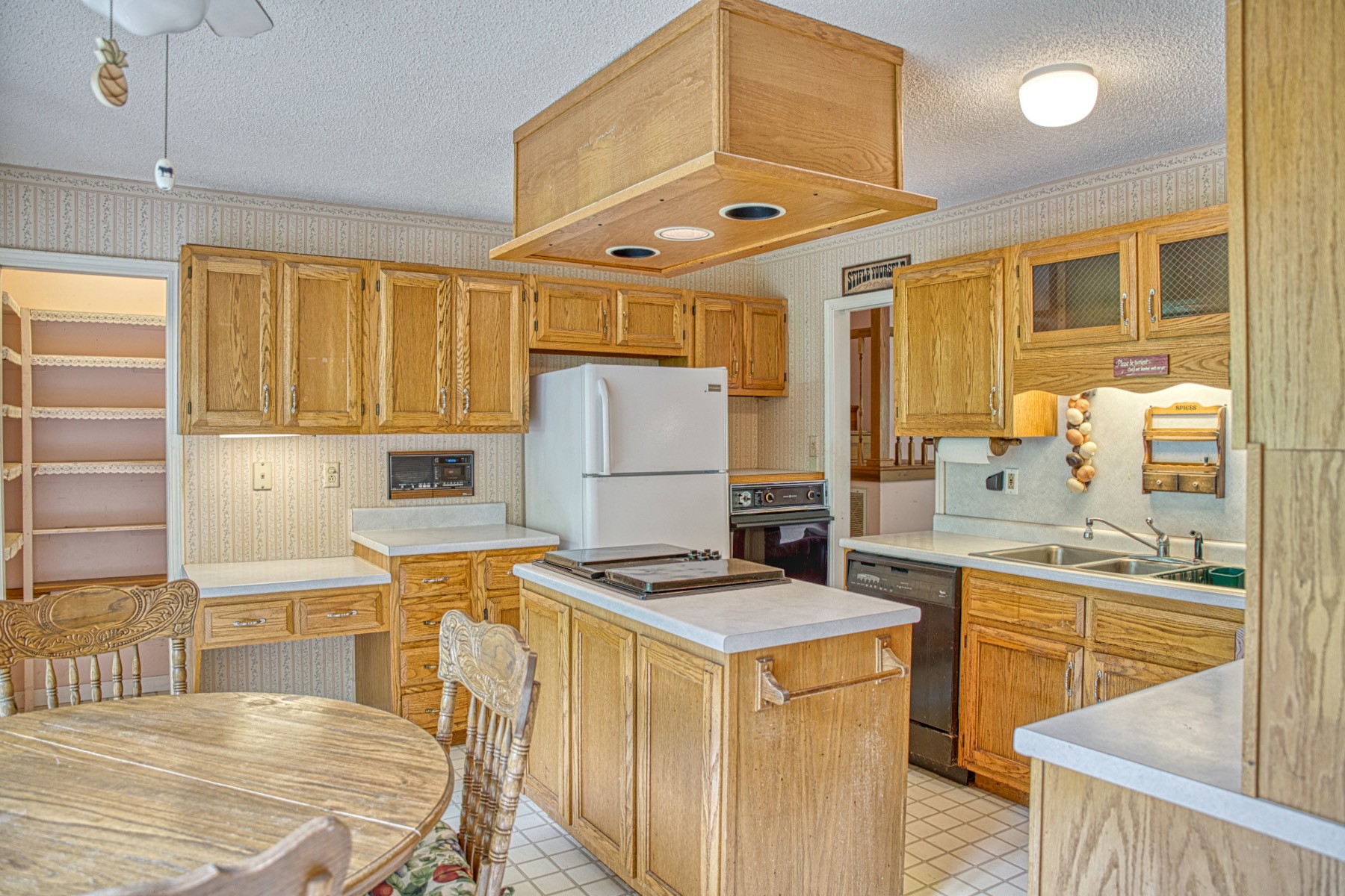 2139 Austin Bottom Road Baxter, TN 38544 - Photo 12 of 64 a kitchen that has a sink a stove and a refrigerator