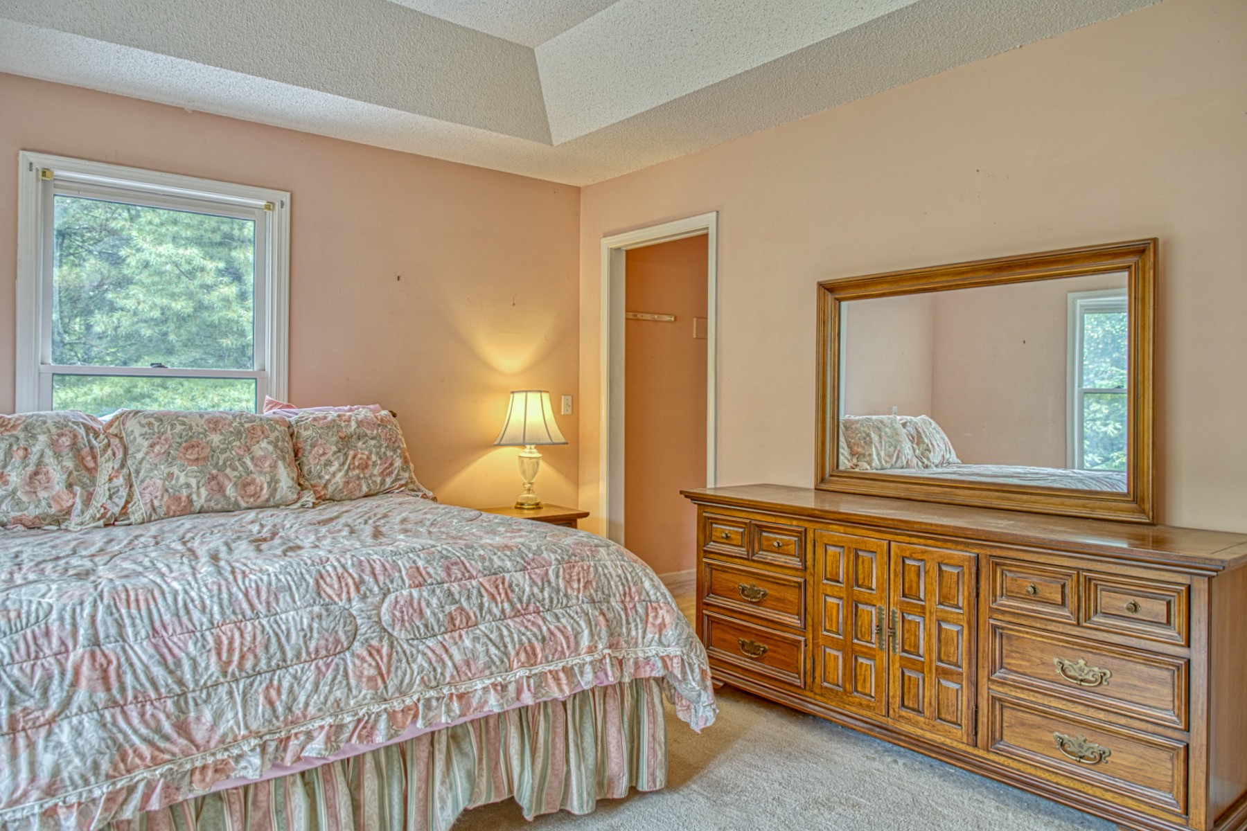 2139 Austin Bottom Road Baxter, TN 38544 - Photo 22 of 64 a bedroom with a bed a dresser and next to a window