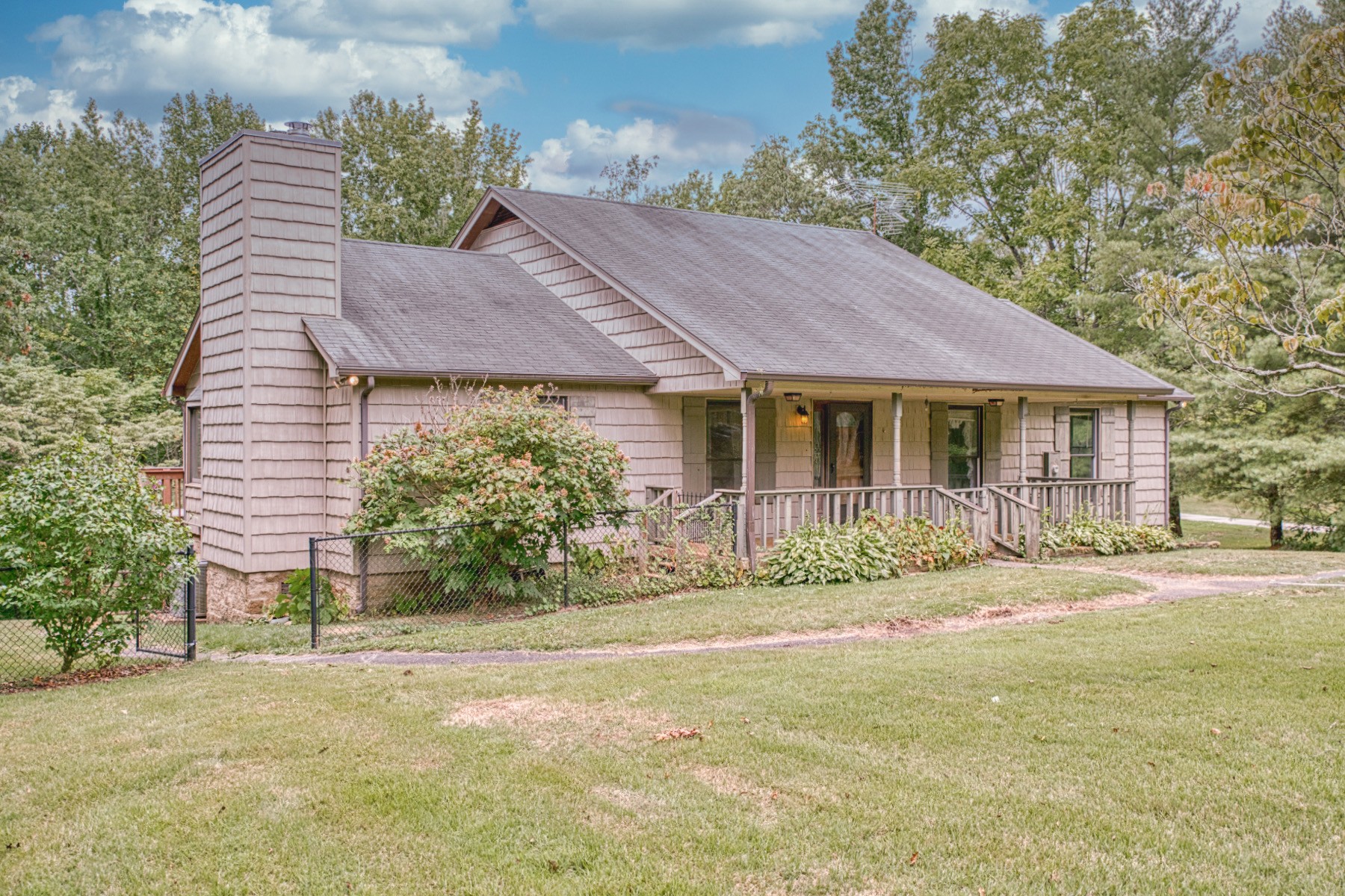 2139 Austin Bottom Road Baxter, TN 38544 - Photo 5 of 64 a front view of a house with a garden and yard