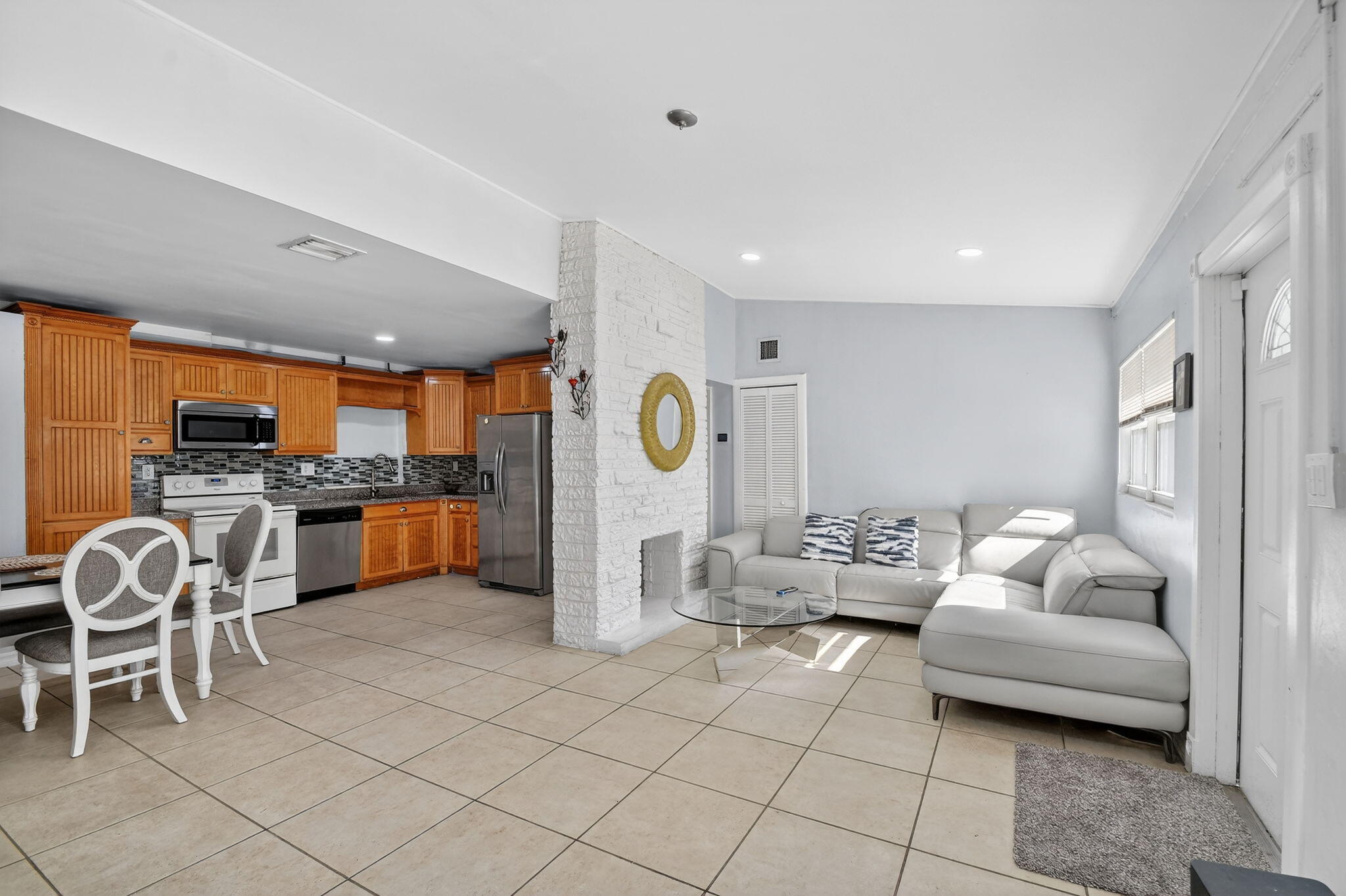 4559 Cole Street West Palm Beach, FL 33417 - Photo 11 of 72 a living room with furniture and kitchen view