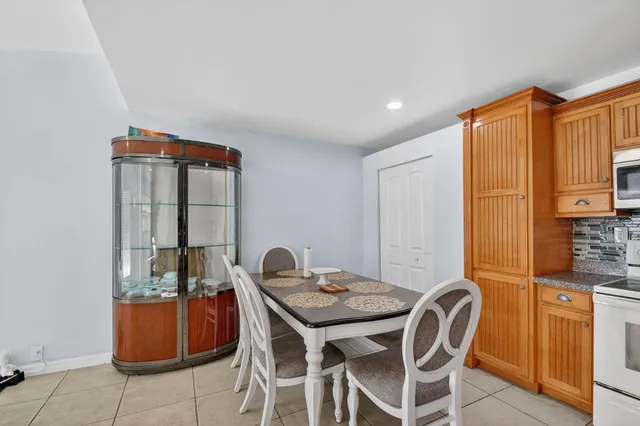 a kitchen with stainless steel appliances kitchen island granite countertop a sink and cabinets