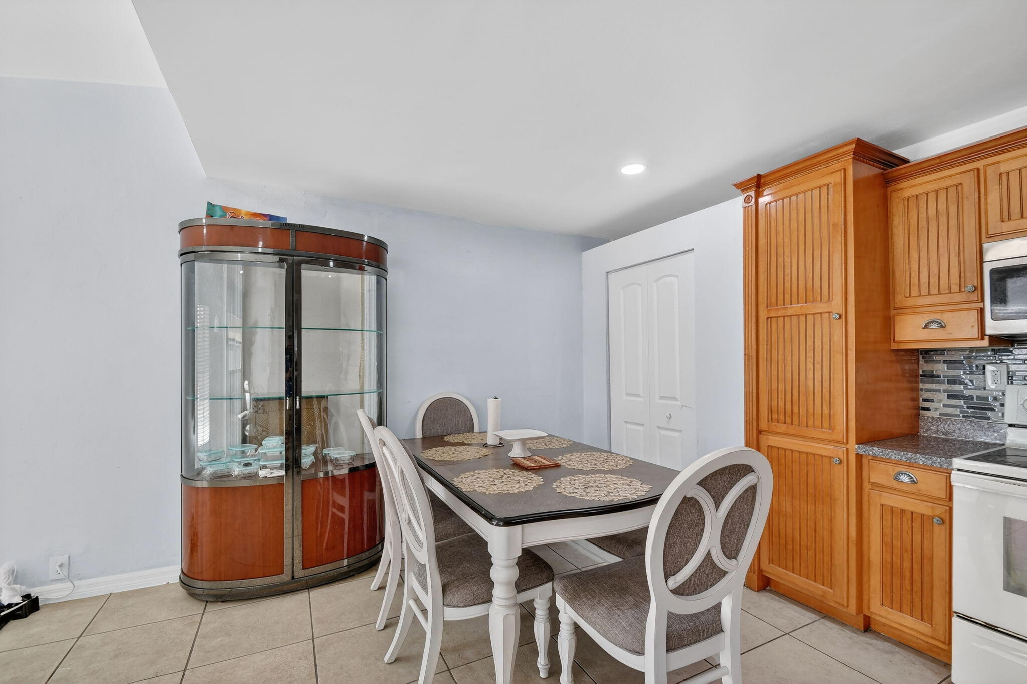 4559 Cole Street West Palm Beach, FL 33417 - Photo 14 of 72 a view of a dining room with furniture and chandelier