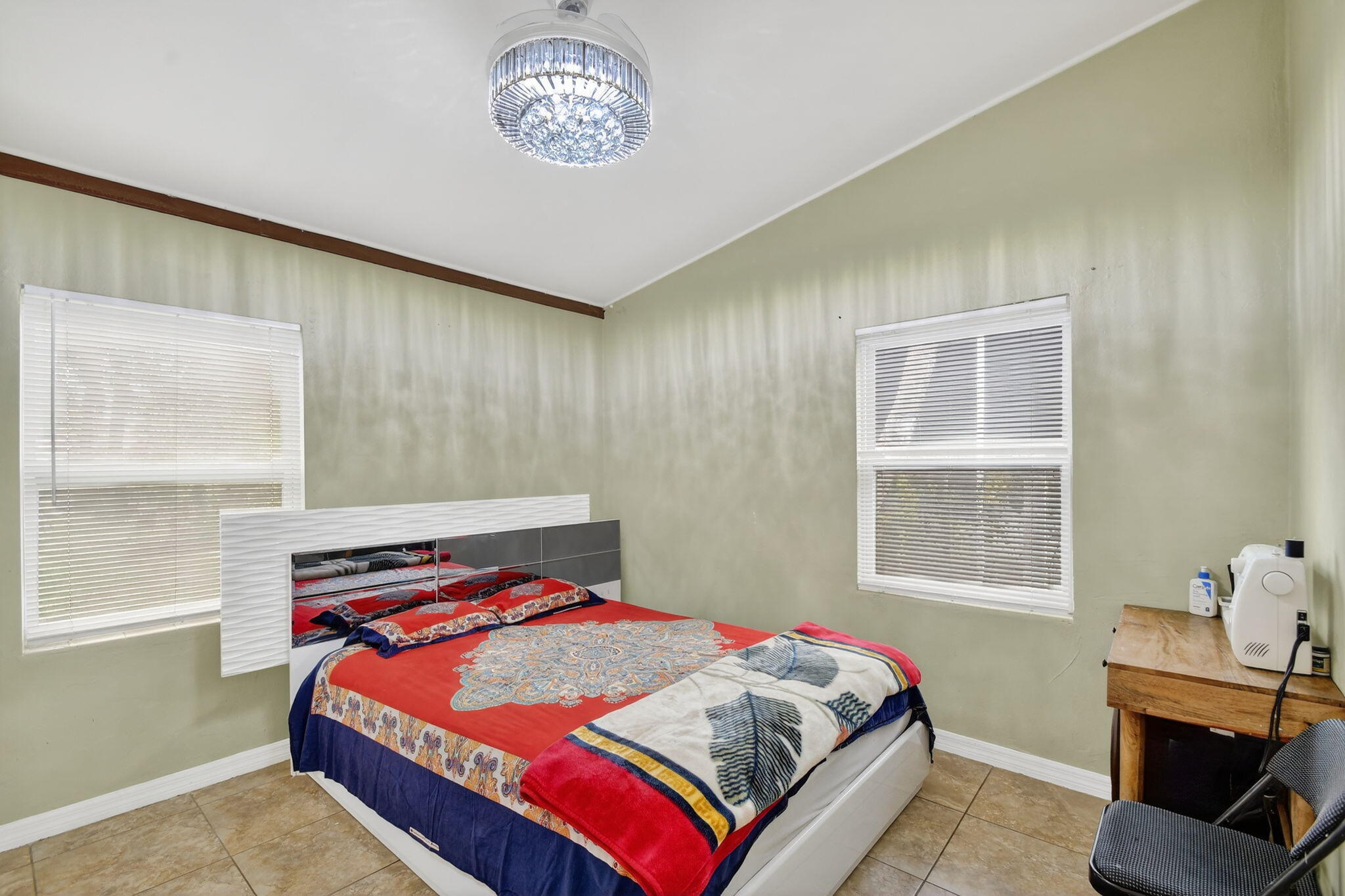 4559 Cole Street West Palm Beach, FL 33417 - Photo 21 of 72 a bedroom with a bed and a window