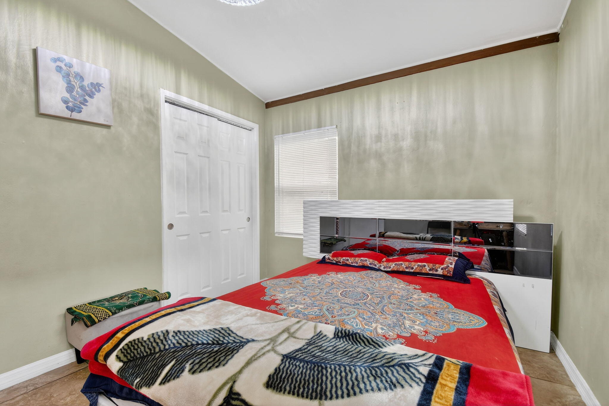 4559 Cole Street West Palm Beach, FL 33417 - Photo 22 of 72 a bedroom with a bed and a painting on the wall