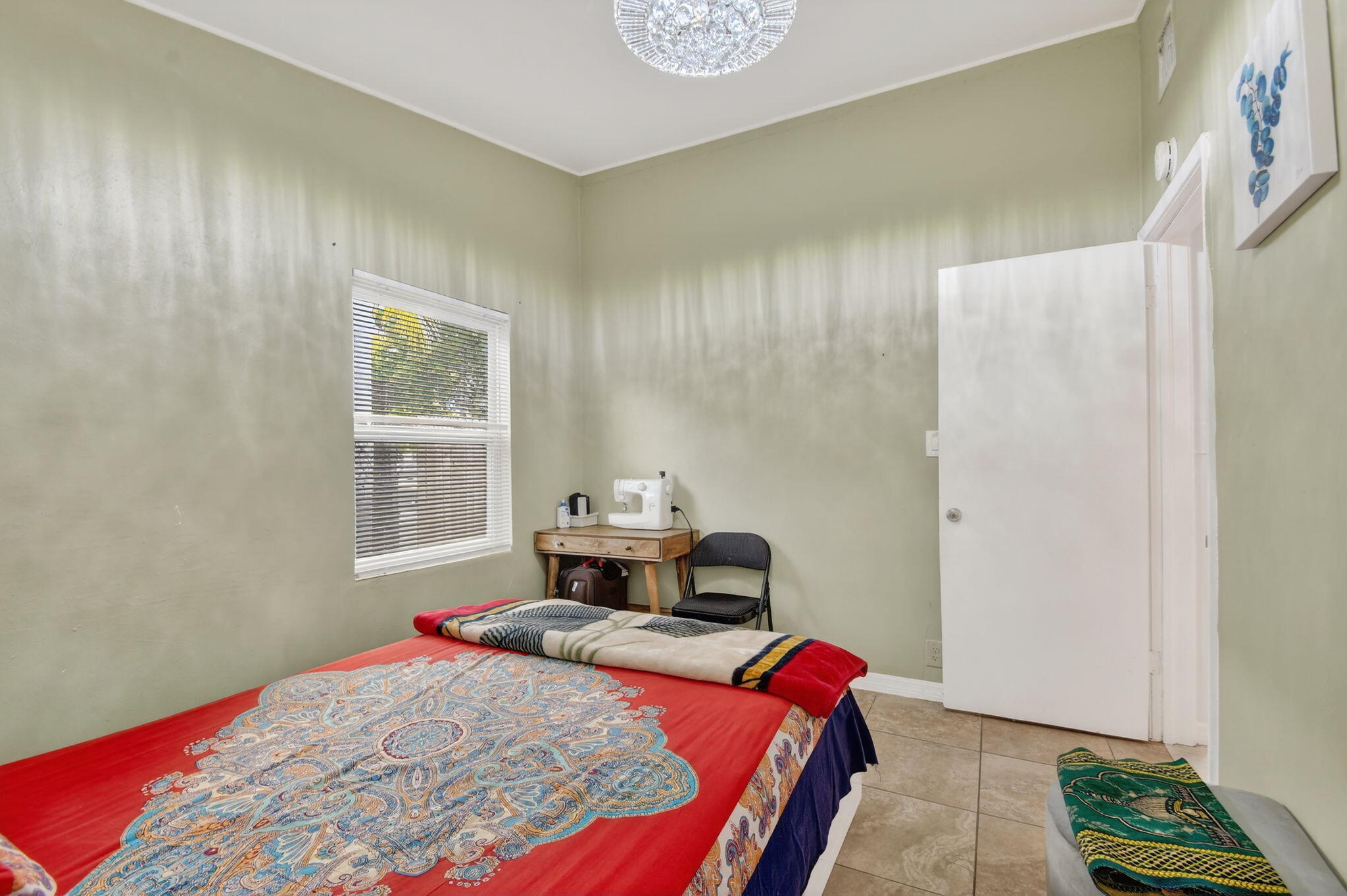 4559 Cole Street West Palm Beach, FL 33417 - Photo 23 of 72 a bedroom with a bed and a window