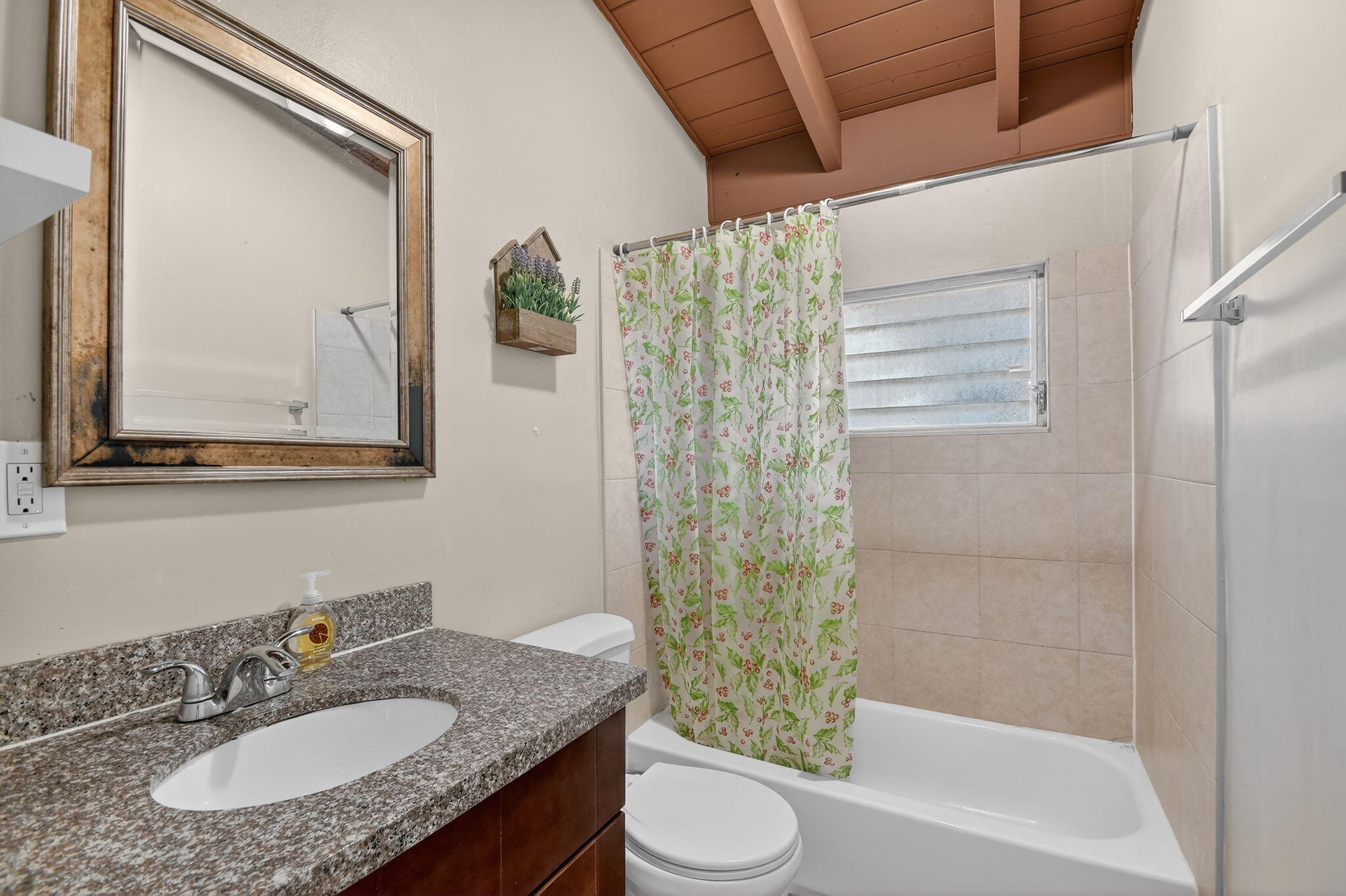 4559 Cole Street West Palm Beach, FL 33417 - Photo 24 of 72 a bathroom with a granite countertop sink toilet a mirror and shower