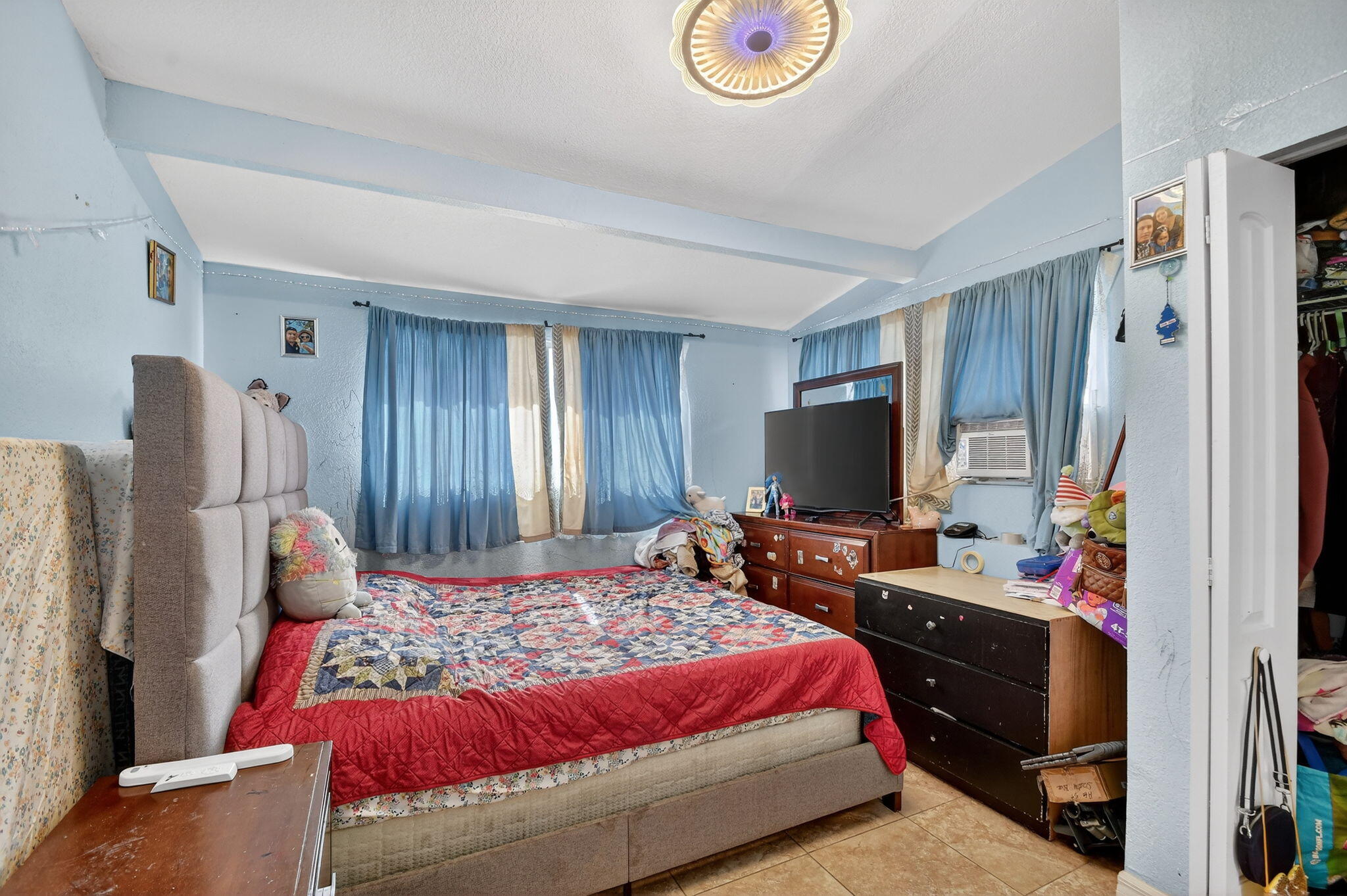 4559 Cole Street West Palm Beach, FL 33417 - Photo 33 of 72 a bedroom with a bed and flat screen tv