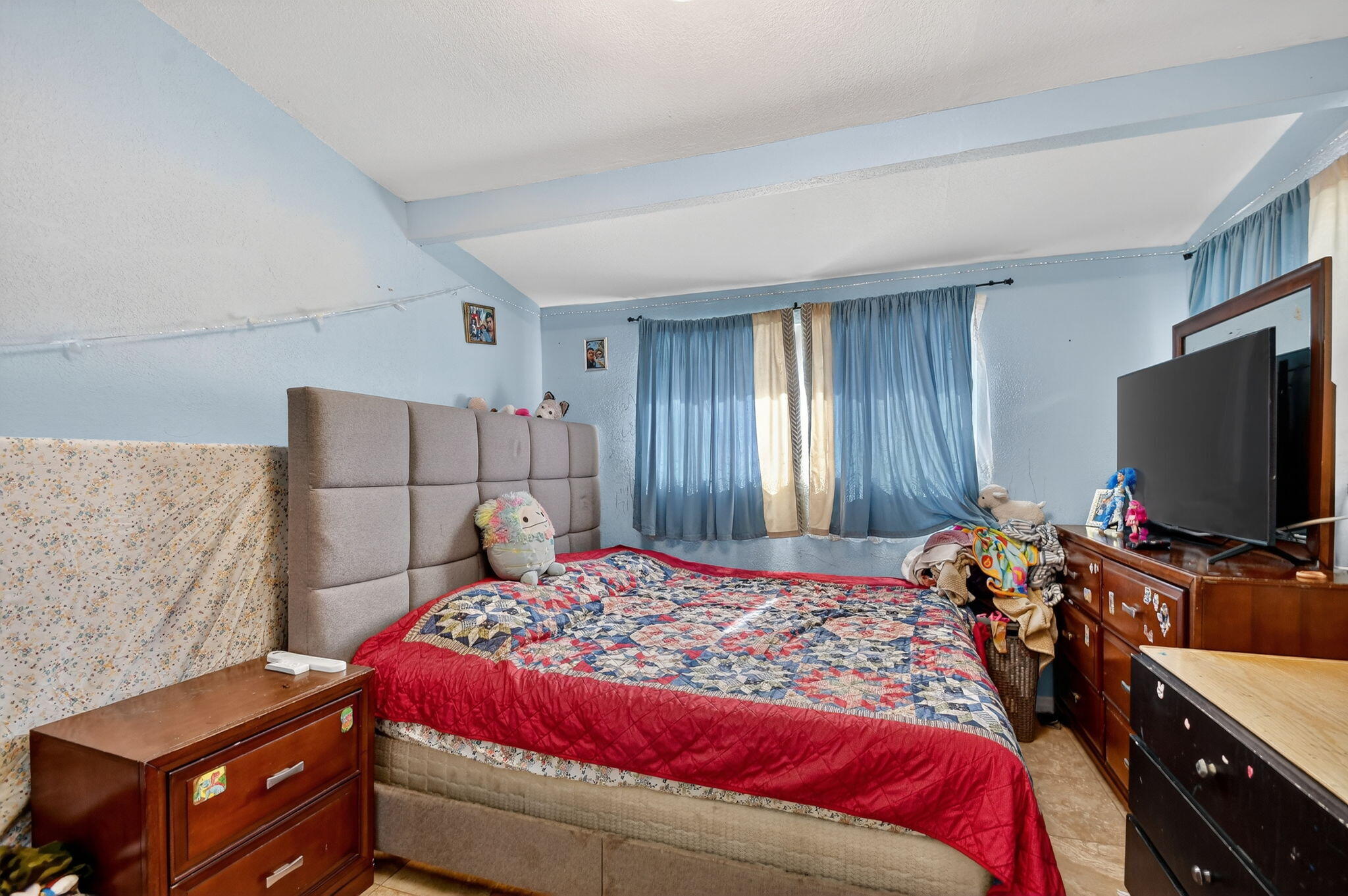 4559 Cole Street West Palm Beach, FL 33417 - Photo 34 of 72 a bedroom with a bed and a flat screen tv