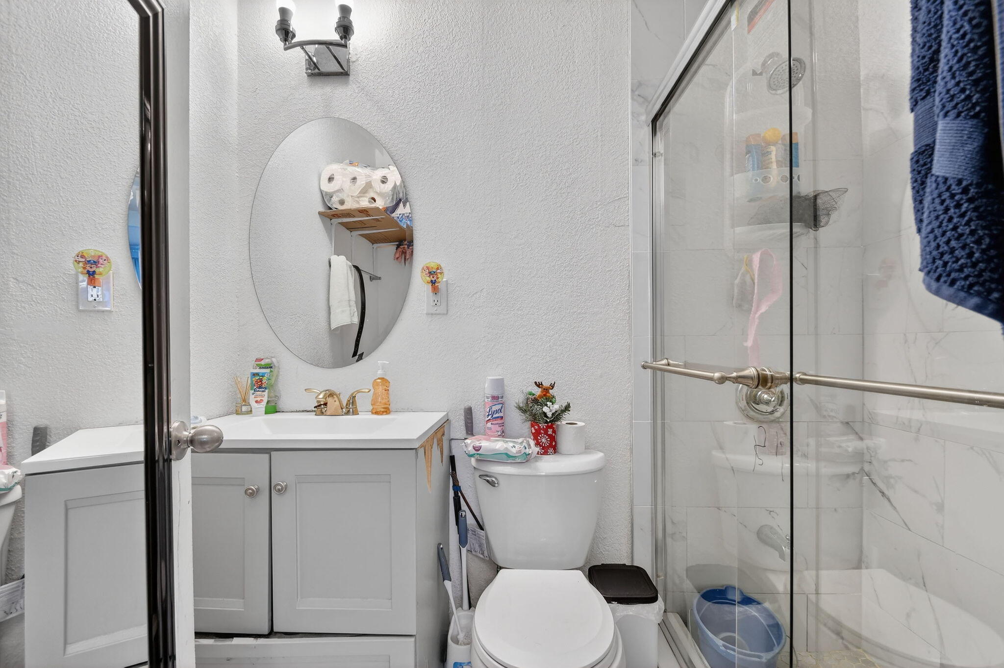 4559 Cole Street West Palm Beach, FL 33417 - Photo 36 of 72 a bathroom with a toilet sink vanity granite and shower