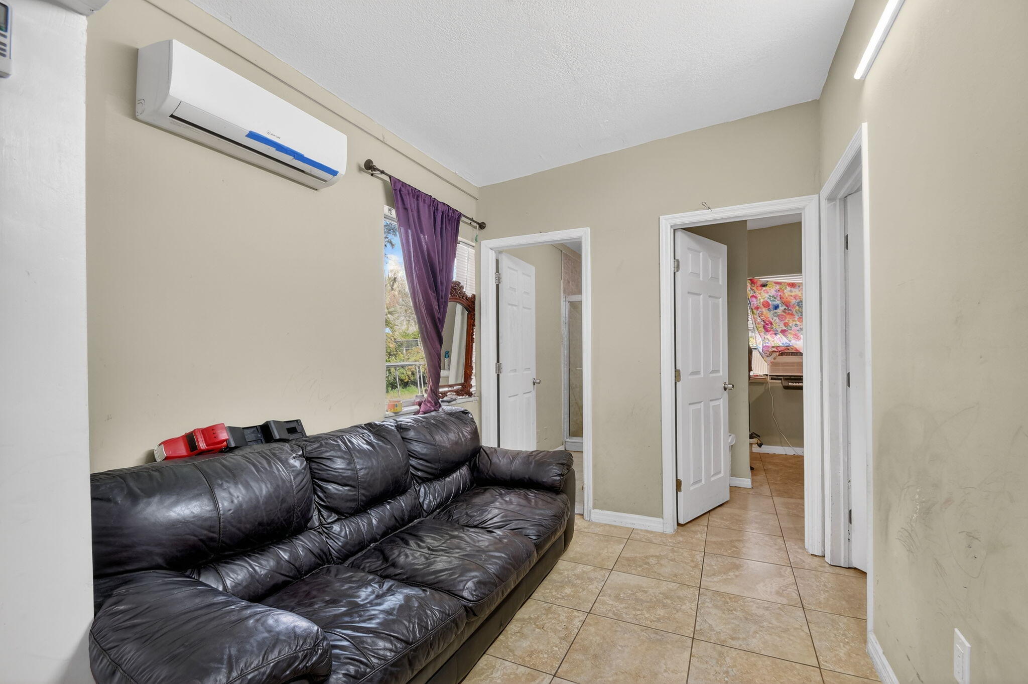 4559 Cole Street West Palm Beach, FL 33417 - Photo 43 of 72 a living room with furniture and a window