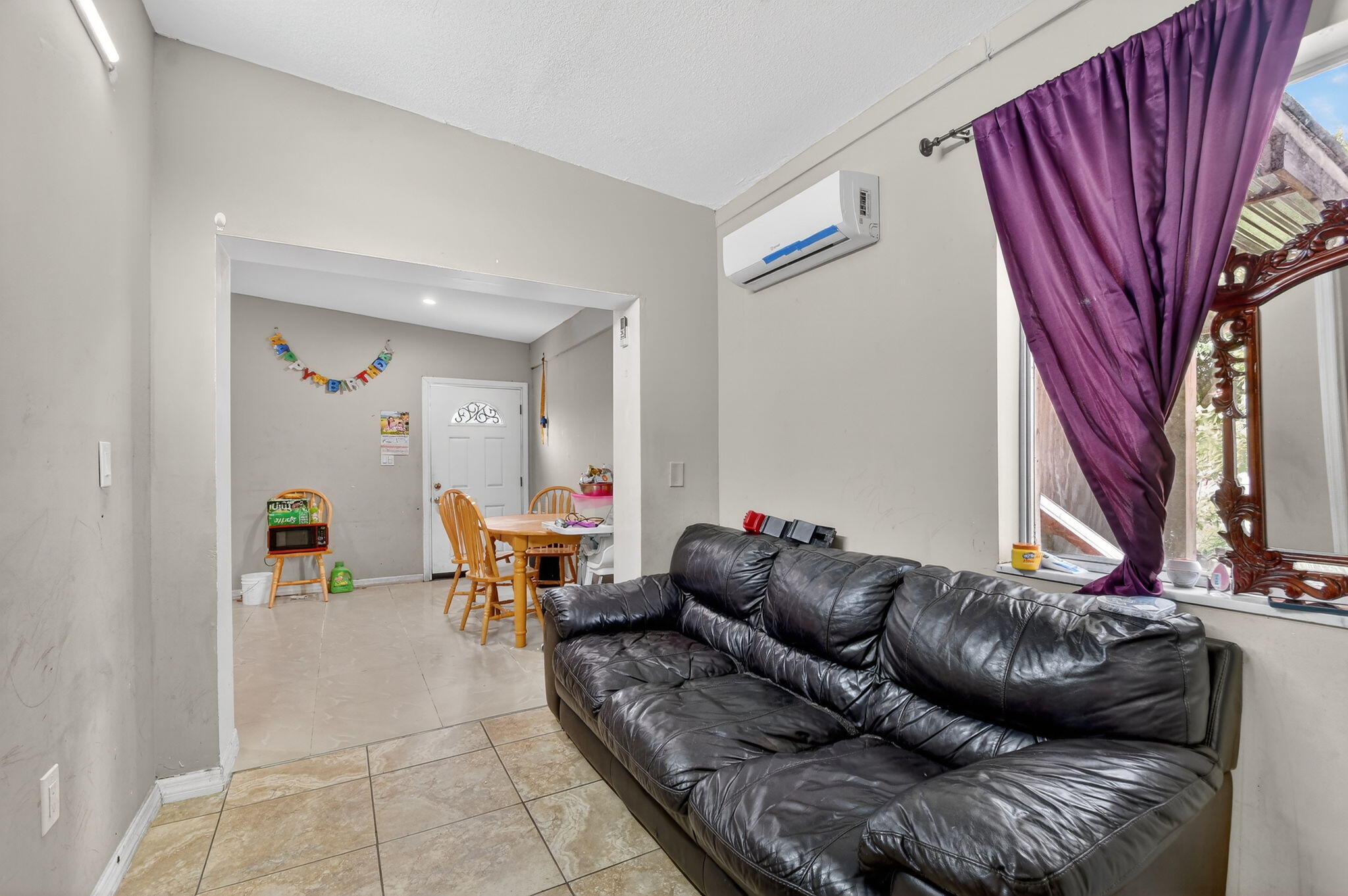 4559 Cole Street West Palm Beach, FL 33417 - Photo 44 of 72 a living room with furniture and a fireplace