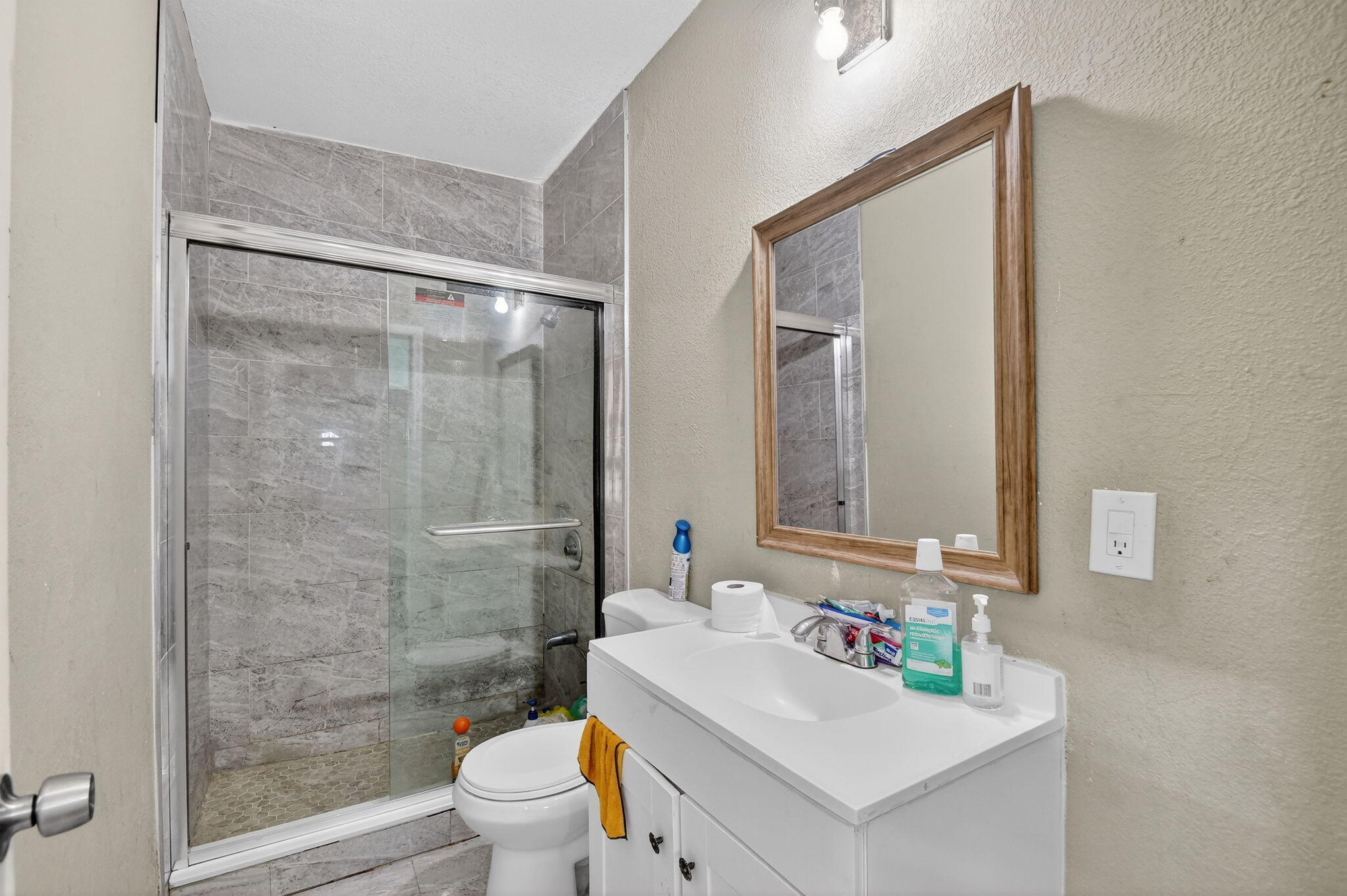 4559 Cole Street West Palm Beach, FL 33417 - Photo 46 of 72 a bathroom with a sink mirror toilet and shower