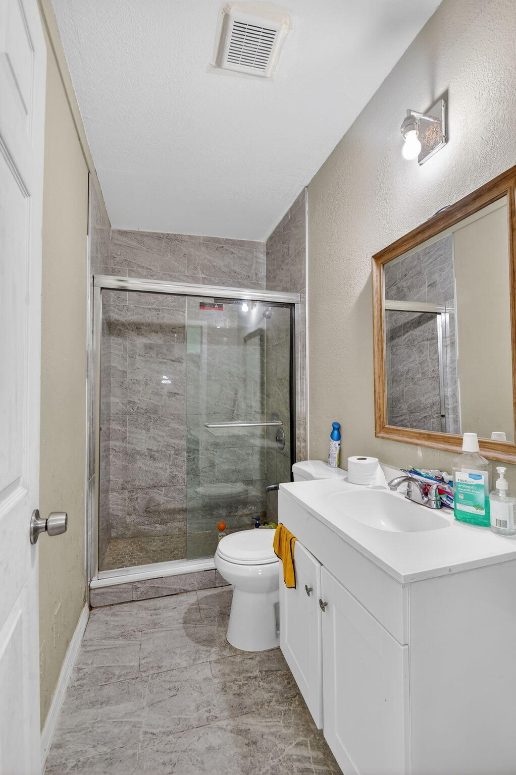 4559 Cole Street West Palm Beach, FL 33417 - Photo 47 of 72 a bathroom with a sink a toilet and shower
