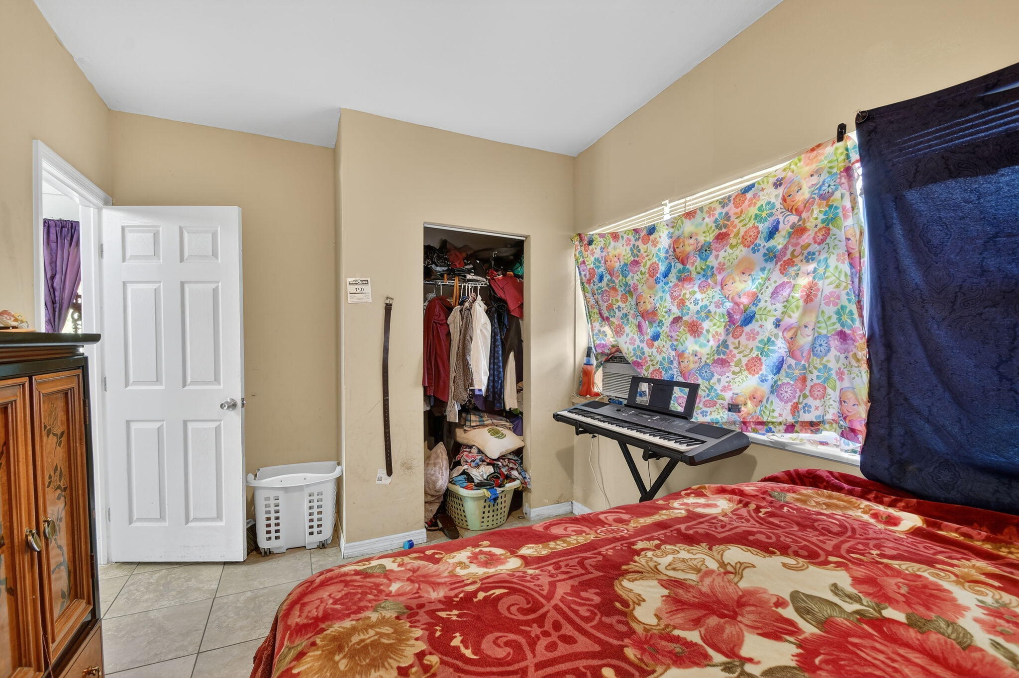 4559 Cole Street West Palm Beach, FL 33417 - Photo 50 of 72 a bedroom with a bed and a walk in closet