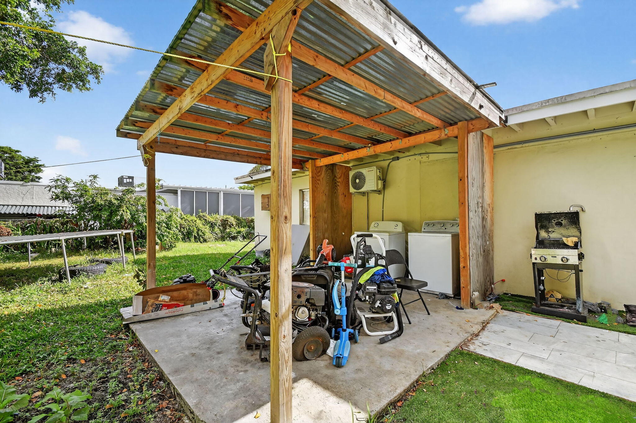 4559 Cole Street West Palm Beach, FL 33417 - Photo 53 of 72 a view of outdoor space yard deck patio and swimming pool