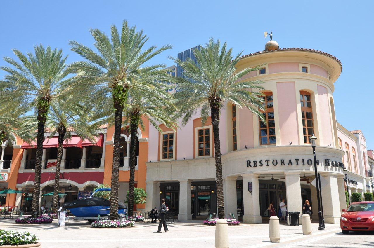 4559 Cole Street West Palm Beach, FL 33417 - Photo 62 of 72 a front view of multi story residential apartment building with yard and outdoor seating