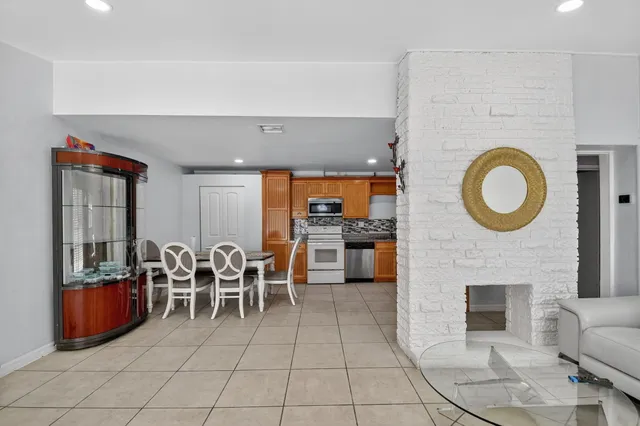 a view of a livingroom with furniture and a flat screen tv
