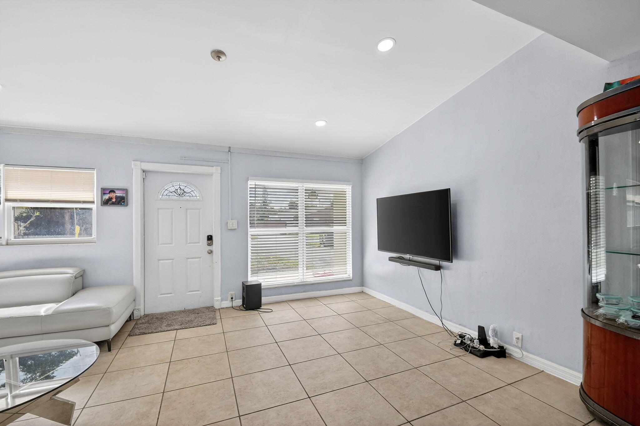 4559 Cole Street West Palm Beach, FL 33417 - Photo 9 of 72 a view of a livingroom with furniture and a flat screen tv