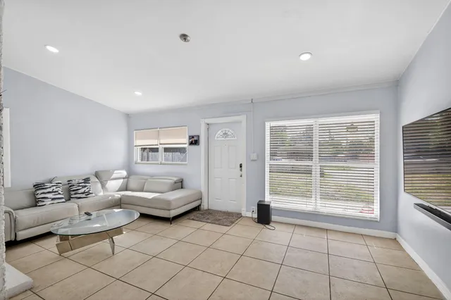 a living room with furniture and a window