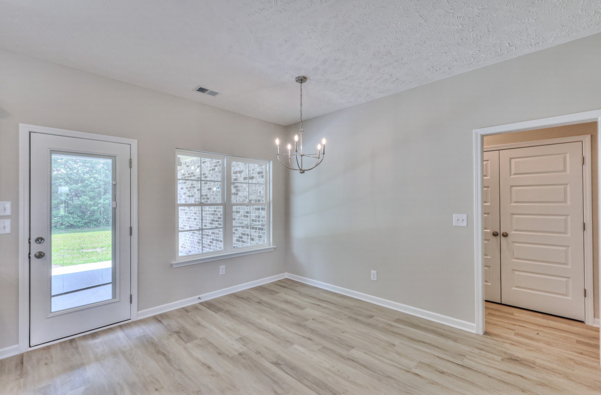 1234 North Fork Branch Road Normandy, TN 37360 - Photo 14 of 38 a view of an empty room with a window and wooden floor