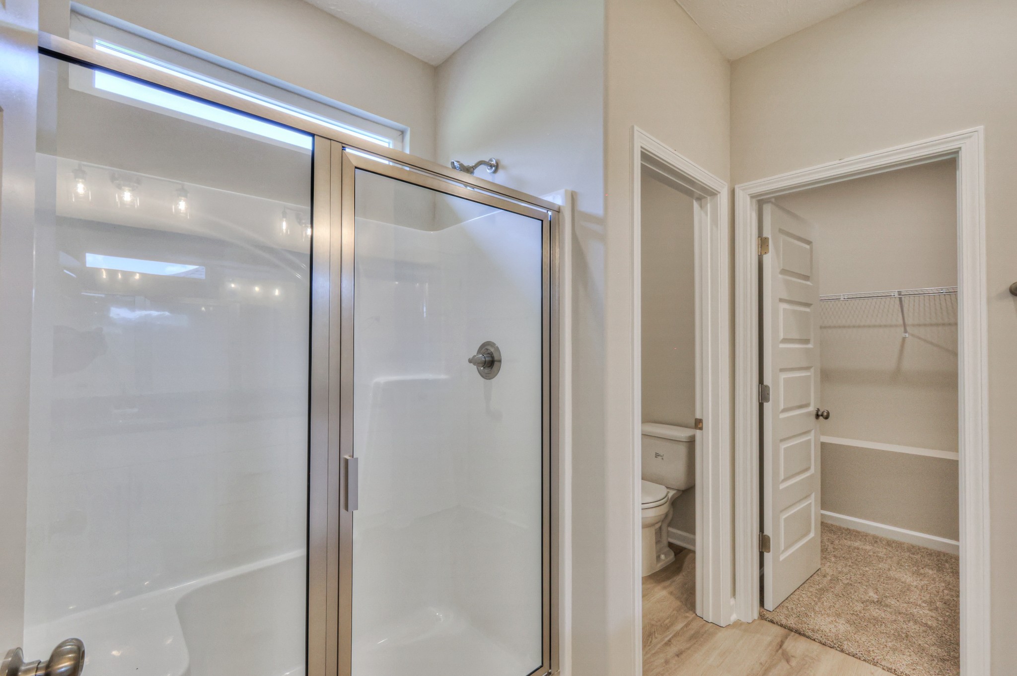 1234 North Fork Branch Road Normandy, TN 37360 - Photo 22 of 38 a bathroom with a glass shower door and a glass door