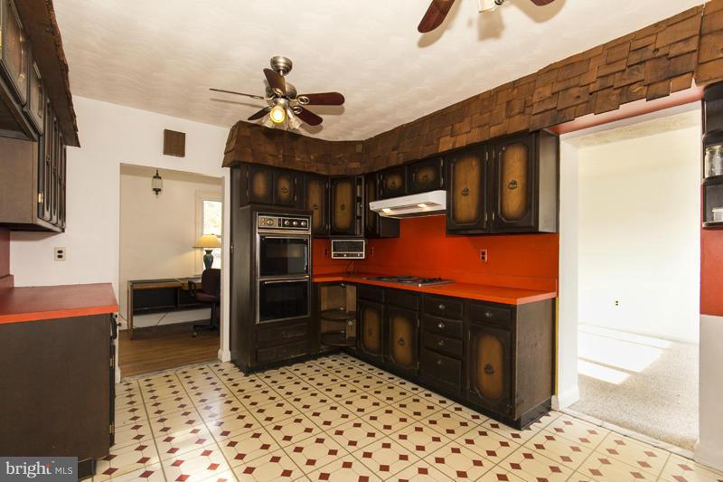 402 Whitaker Mill Road Fallston, MD 21047 - Photo 16 of 29 a kitchen with stainless steel appliances granite countertop a stove a sink and a refrigerator