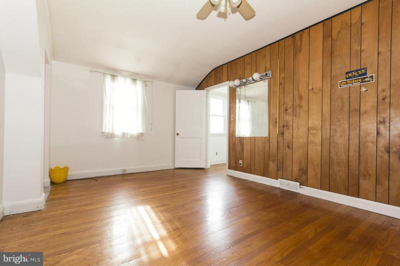 402 Whitaker Mill Road Fallston, MD 21047 - Photo 20 of 29 a view of an empty room with wooden floor and a window