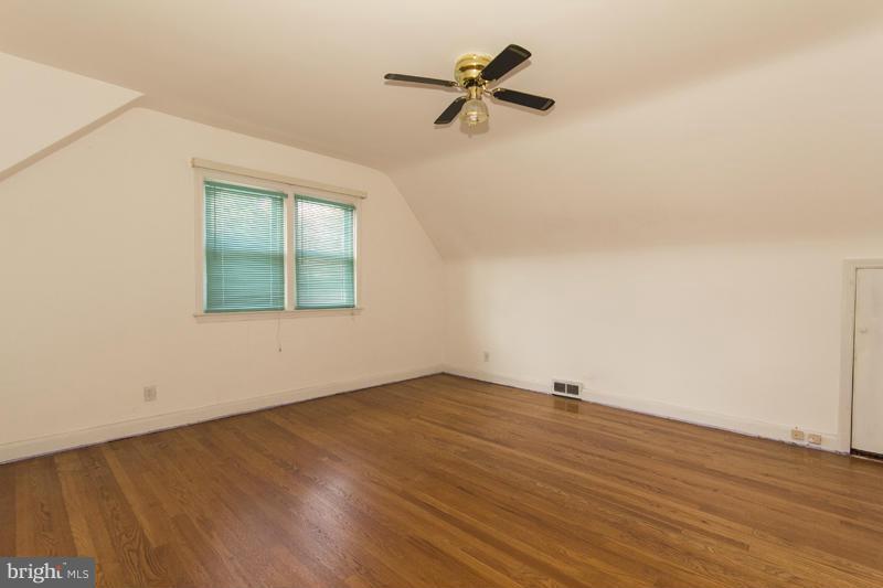 402 Whitaker Mill Road Fallston, MD 21047 - Photo 22 of 29 a view of a room with wooden floor and a ceiling fan