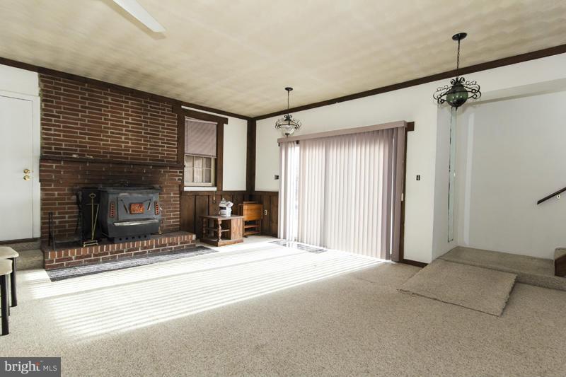 402 Whitaker Mill Road Fallston, MD 21047 - Photo 24 of 29 a view of a livingroom with a fireplace and window