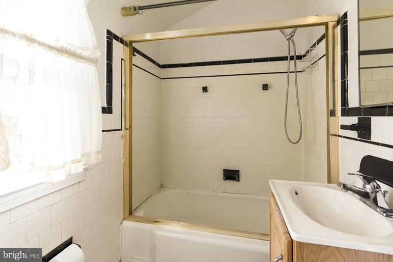 402 Whitaker Mill Road Fallston, MD 21047 - Photo 26 of 29 a bathroom with a tub shower sink and vanity