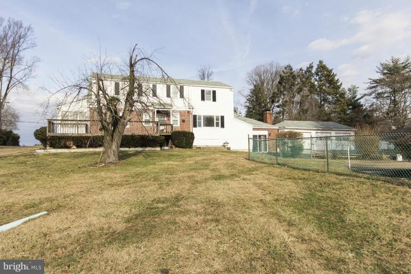 402 Whitaker Mill Road Fallston, MD 21047 - Photo 4 of 29 a front view of a house with a yard and fountain