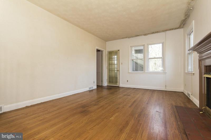 402 Whitaker Mill Road Fallston, MD 21047 - Photo 8 of 29 an empty room with wooden floor and windows