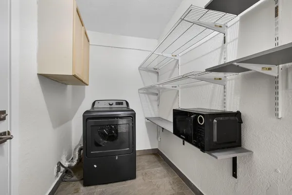 a kitchen with stainless steel appliances granite countertop a stove and a refrigerator