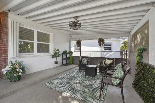 a view of a chairs and table in a patio