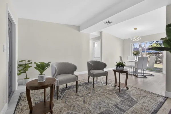 a living room with furniture and a rug