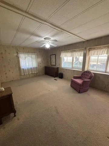 a living room with a couch and fireplace