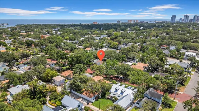 an aerial view of city and green space