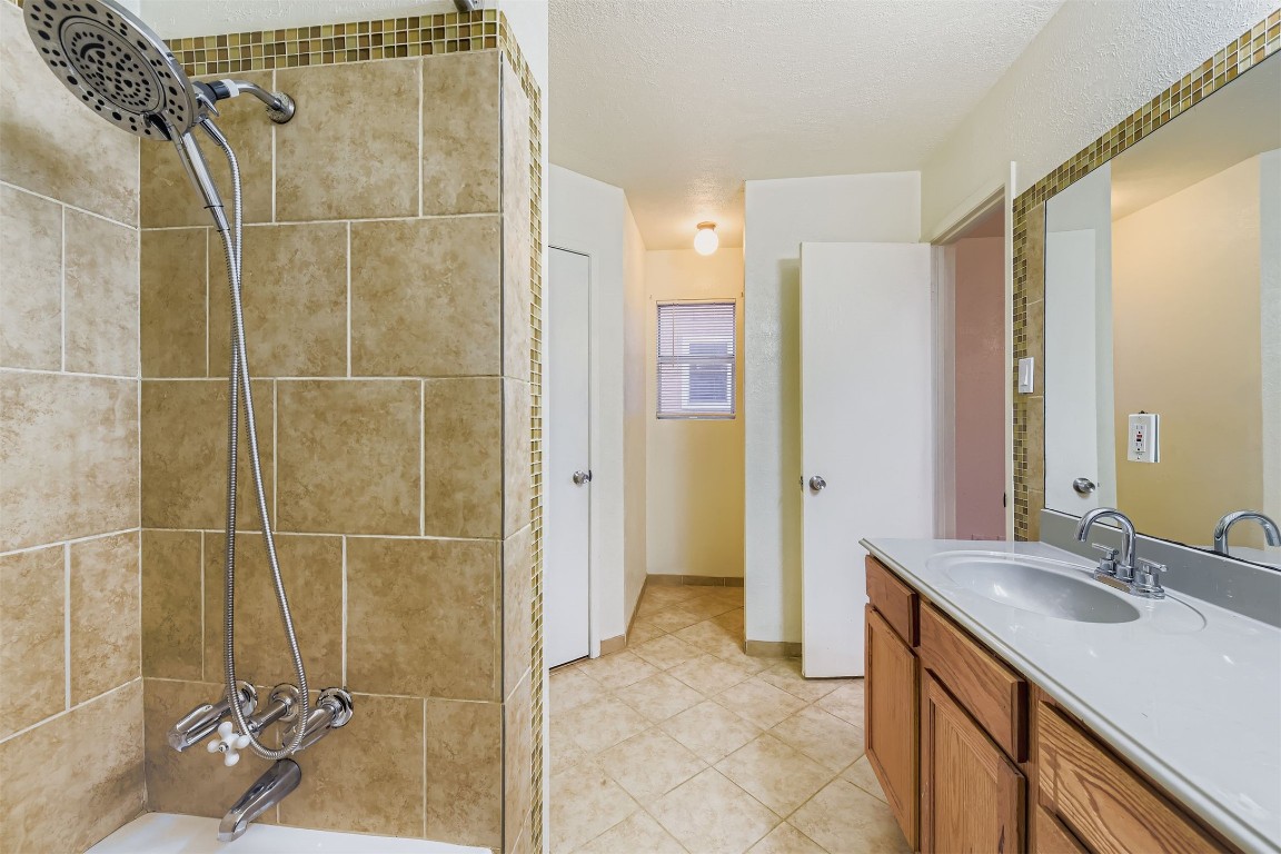 3104 Dominic Drive Austin, TX 78745 - Photo 17 of 28 Full bath featuring vanity and washtub / shower combination